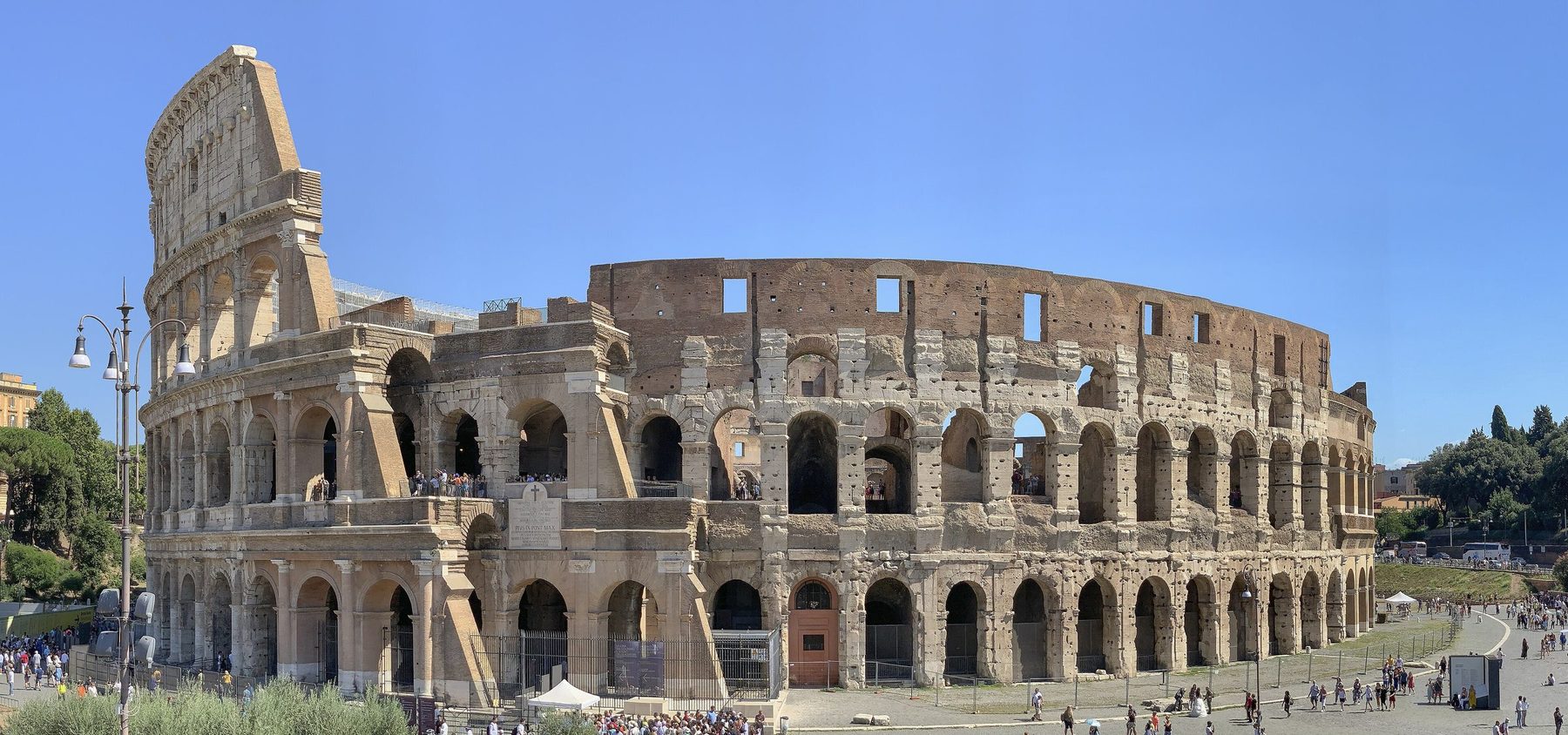 The Colosseum from the Via Sacra side on a sunny day